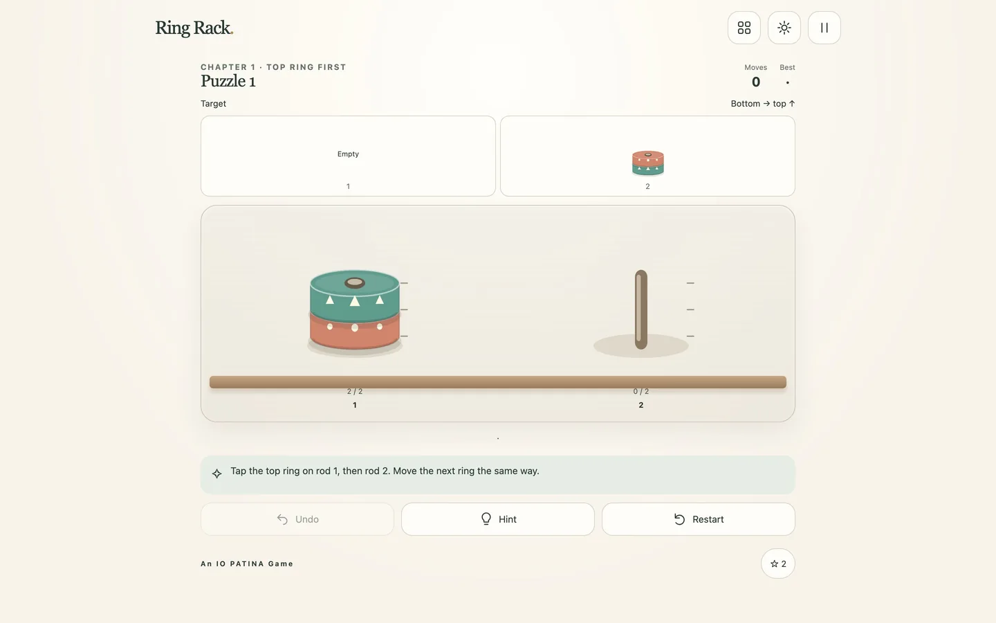 The first-level board on a desktop screen, showing rings stacked on rods beside their target patterns